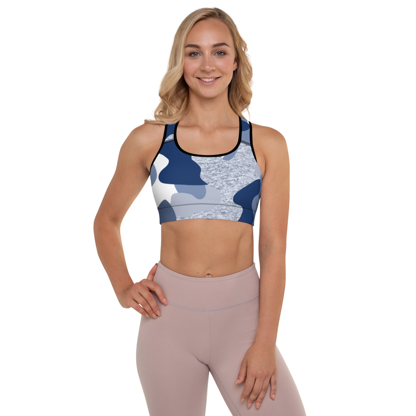 a woman wearing a blue and white Sweetest Paw Padded Sports Bra Camo top.