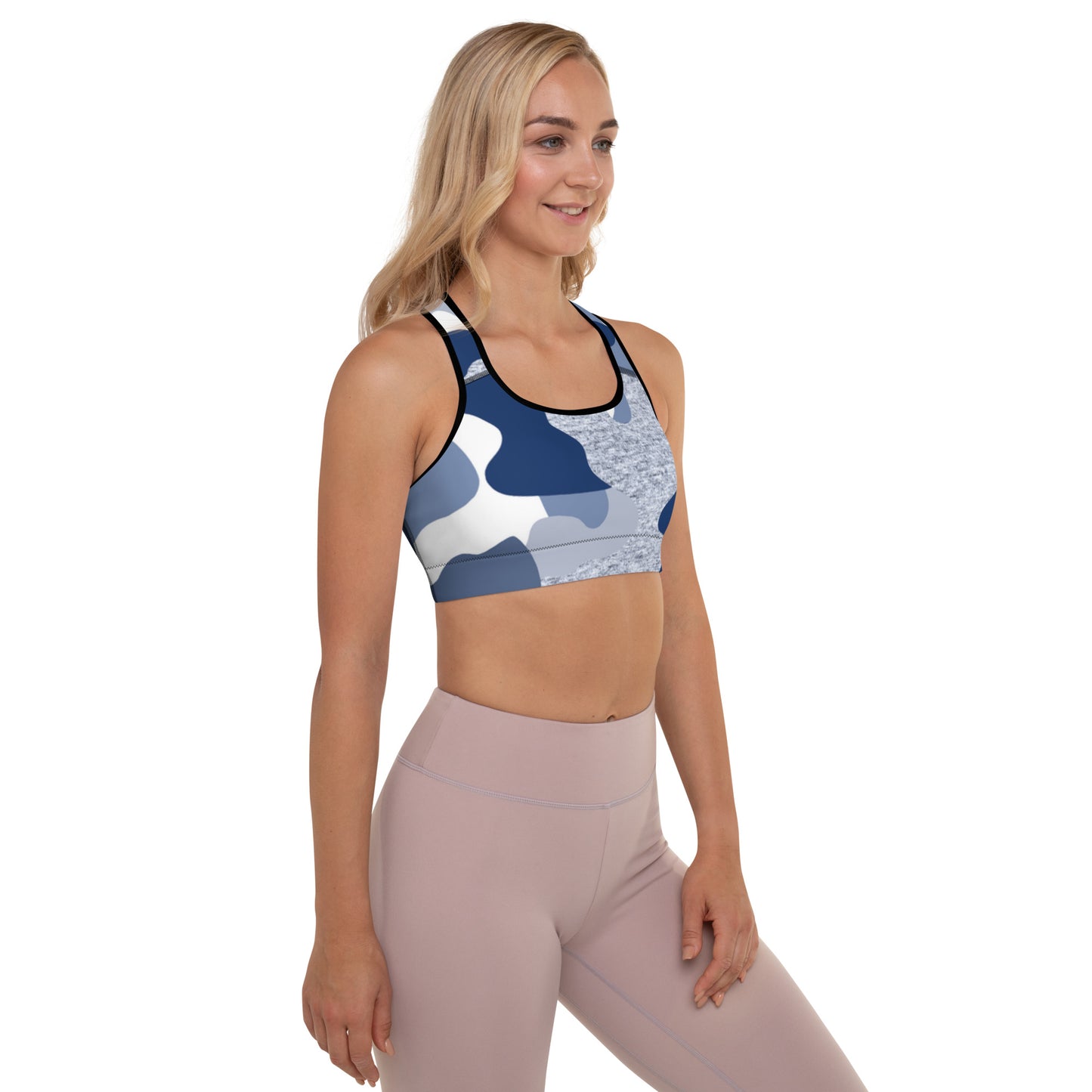 a woman wearing a blue and white Sweetest Paw Padded Sports Bra Camo top.