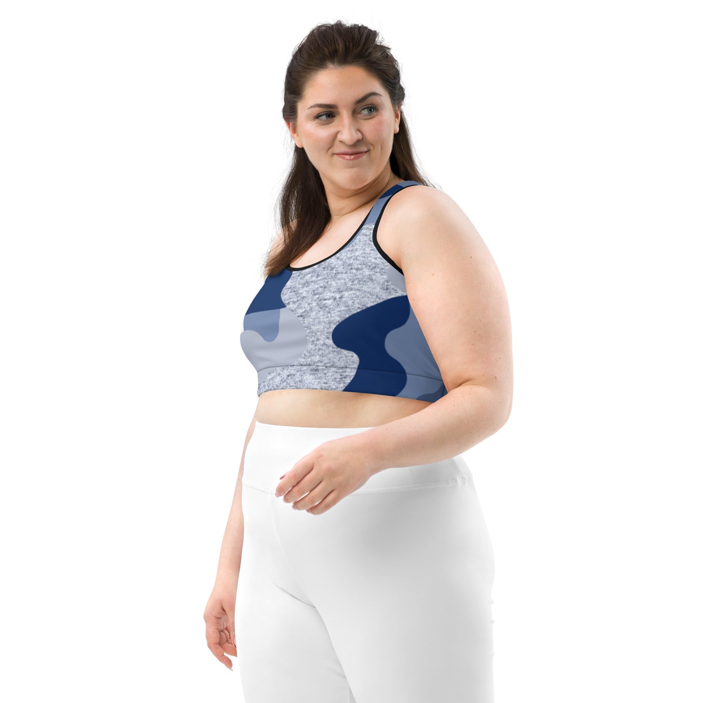 a woman in white pants and a Sweetest Paw Sports Bra Camo top.