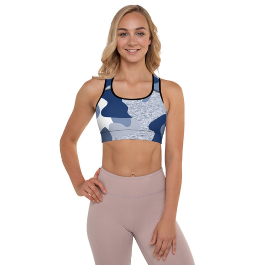 a woman wearing a blue and white Sweetest Paw Padded Sports Bra Camo top.