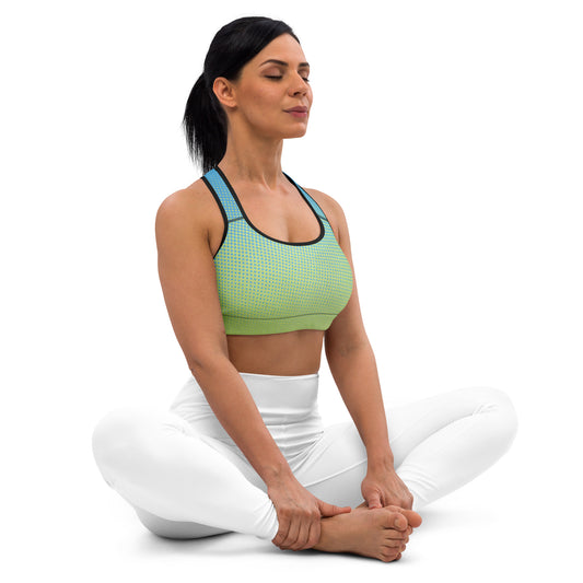 A woman is sitting in a yoga pose wearing the Padded Sports Bra Multi from Sweetest Paw.