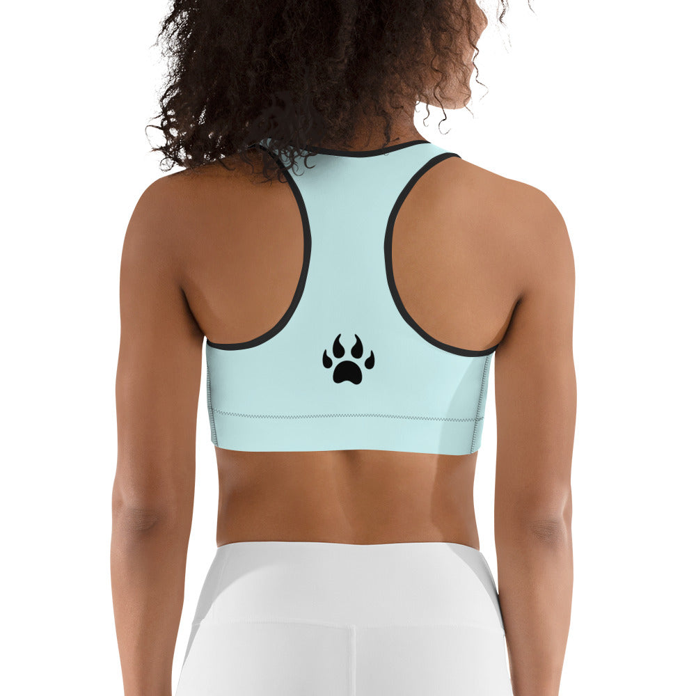 The back of a woman wearing a Sweetest Paw Sports Bra Teal with paw print.