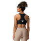 The back view of a woman wearing a Sweetest Paw Sports Bra Black.