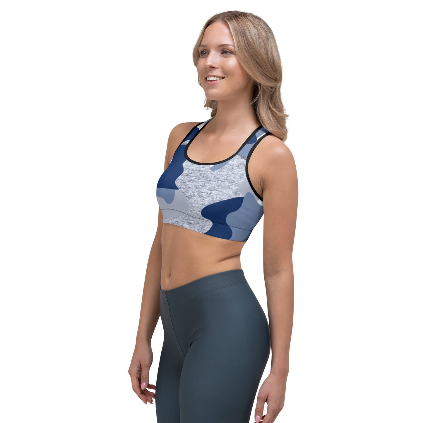 a woman wearing a blue and gray Sweetest Paw Sports Bra Camo top.