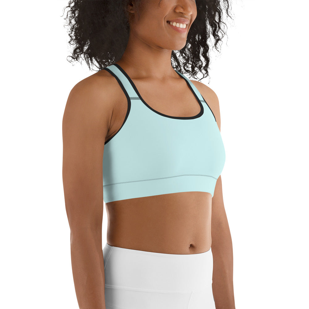 A woman wearing a Sweetest Paw Sports Bra Teal top.