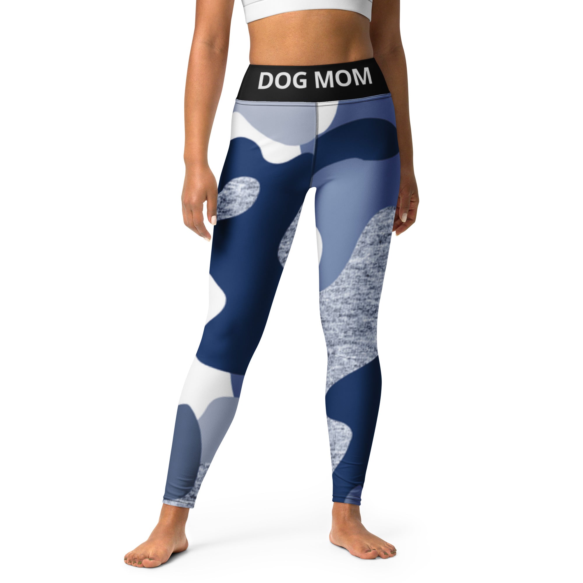 A woman wearing Sweetest Paw Yoga Leggings Camo with the word dog mom.