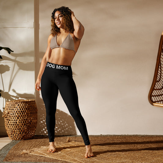A woman in a bikini poses in front of a Sweetest Paw Yoga Leggings Black.