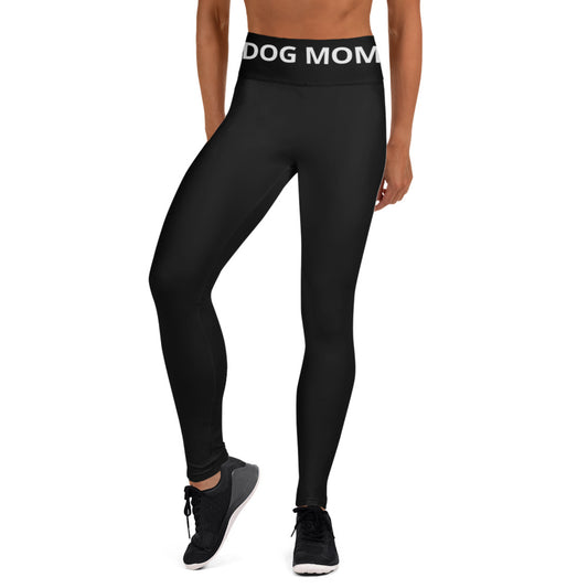 A woman wearing Sweetest Paw black yoga leggings with the word dog mom on them.