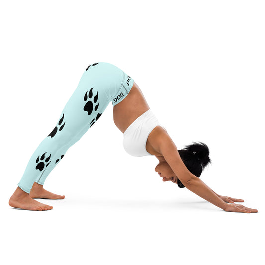 A woman doing yoga with Sweetest Paw's Yoga Leggings Teal PawPrint.