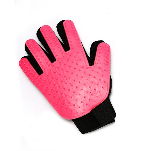 a Pink Sweetest Paw Pet Grooming Brush Glove with black dots on it.
