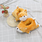 two Cute Shiba Inu Dog Slippers from Sweetest Paw on a table.