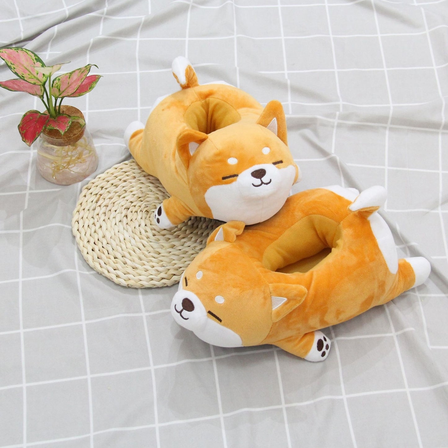 two Cute Shiba Inu Dog Slippers from Sweetest Paw on a table.